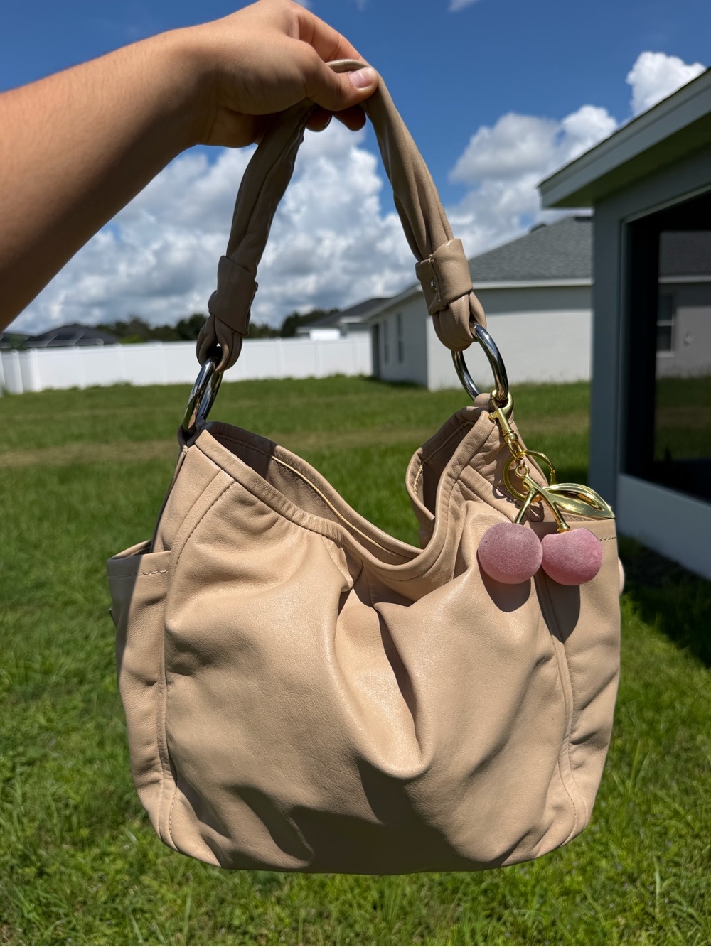 Beige slouchy coach Parker shoulder bag pink interior